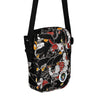 cross body bag with many tattoo styled black panther heads all over it