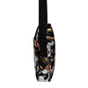 Crossbody bag with a black background and colorful tattoo themed black panther  pattern on a white background