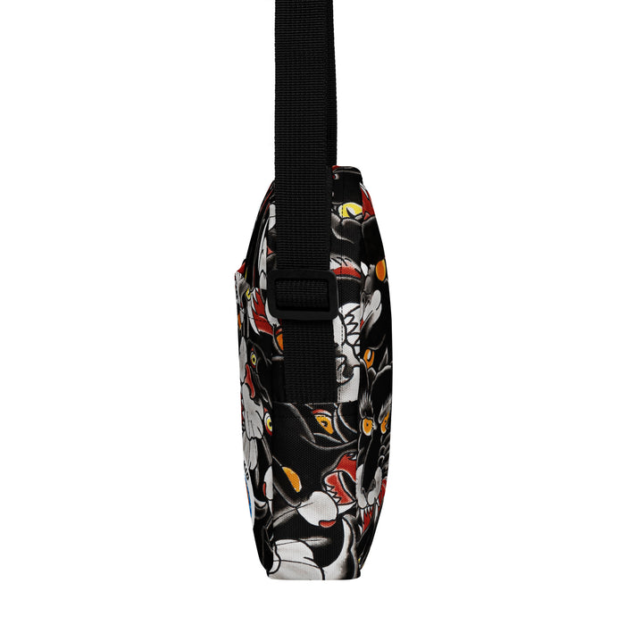Crossbody bag with a black background and colorful tattoo themed black panther  pattern on a white background