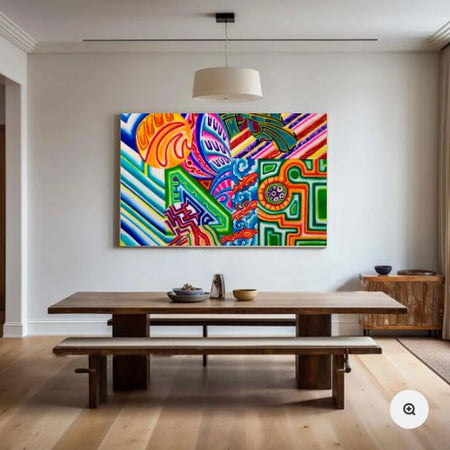 A large, vibrant abstract canvas print with multicolored patterns hangs on a white wall above a wooden dining table and bench in a modern, sunlit room.