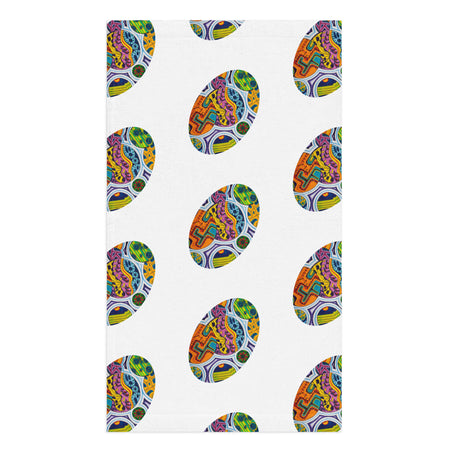 hand towel featuring repeating ovals of multicolored geometric shapes