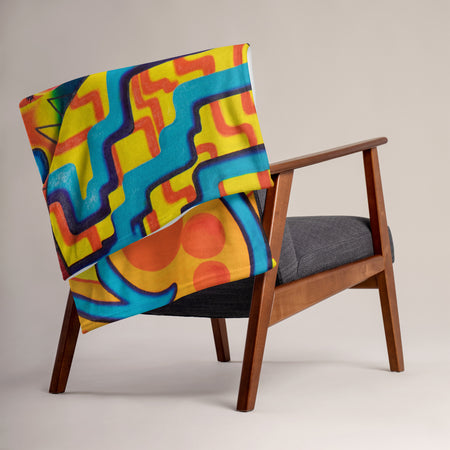 throw blanket with multicolored abstract, geometric imagery