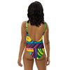  back view on woman wearing an original art one piece womens swimsuit with a multicolored all over psychedelic print of geometric shapes
