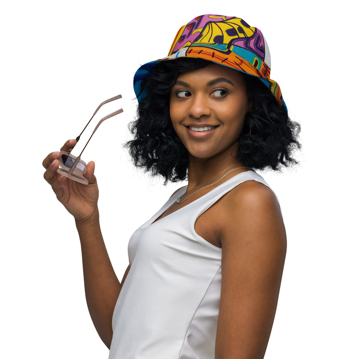 Woman wearing a colorful bucket hat holding sunglasses on a white background