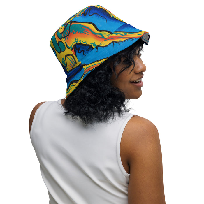 Person wearing a colorful bucket hat on a white background