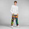 Person wearing colorful pants and a white hoodie on a gray background