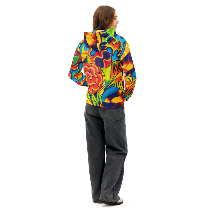 view from behind of a woman wearing an original multi colored psychedelic all over print hoodie in a painterly style