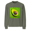 a light green long sleeved t-shirt featuring original art of a sliced avocado showing its pit radiating bands of psychedelic green, light green, and yellow