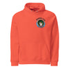 orange hoodie with a circular design on the back of many traditional tattoo designed black panther heads inside of it.