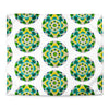 white duvet with an abstract circular repeating pattern made of circles in turquoise, green, and yellow.