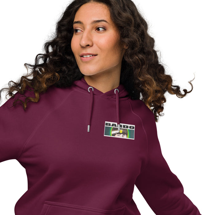 Woman wearing a maroon hoodie with a bardo kid logo of a young boys face on a white background