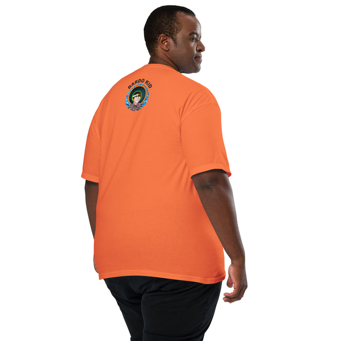 man wearing a orange t-shirt with a very bright geometric colored abstract piece of art contained within a rectangle, with the word pulse in bold black print hovering in front of it.