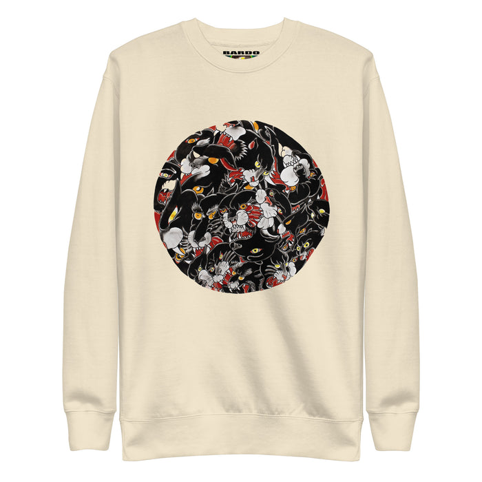 a beige sweatshirt  with a circular image of many tattoo illustrations of a black panther head tightly overlapping each other in the circle