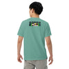 boy wearing a light green t-shirt with distorted cartoon devil head on front and bardo kid logo on back