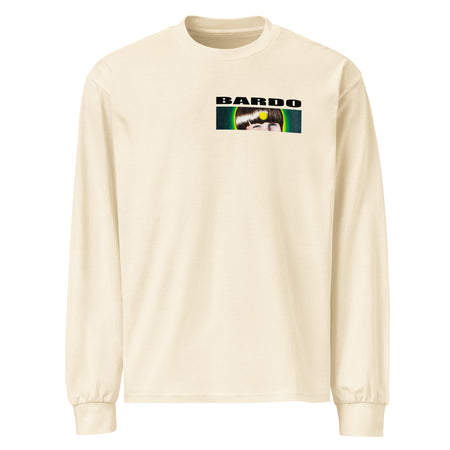 a long sleeved off white t-shirt with a circular shape on front containing a old time style carnival devil head