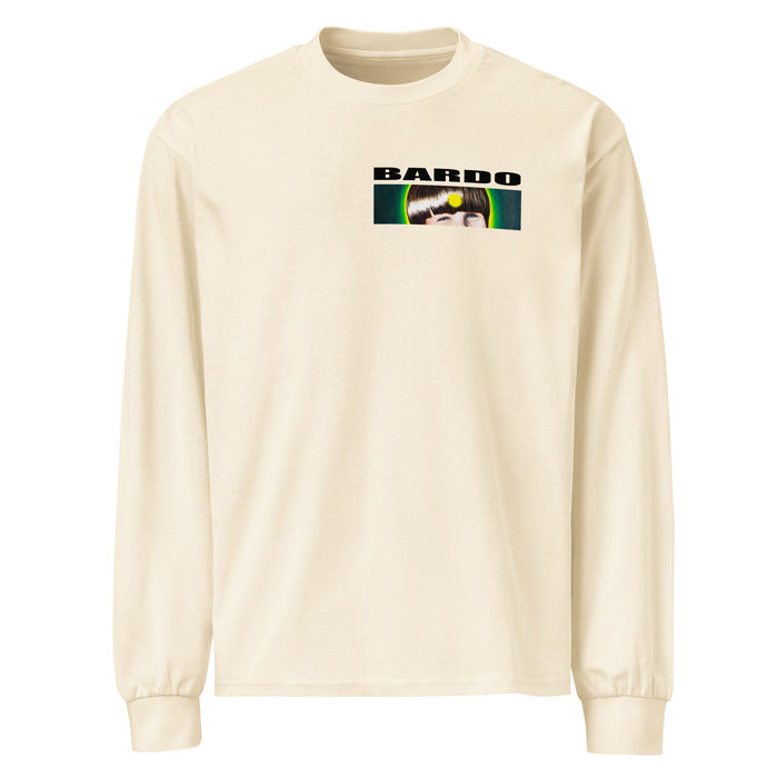 a long sleeved off white t-shirt with a circular shape on front containing a old time style carnival devil head