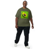 man wearing a a deep green t-shirt with realistic art of an avocado radiating green and yellow bands of energy