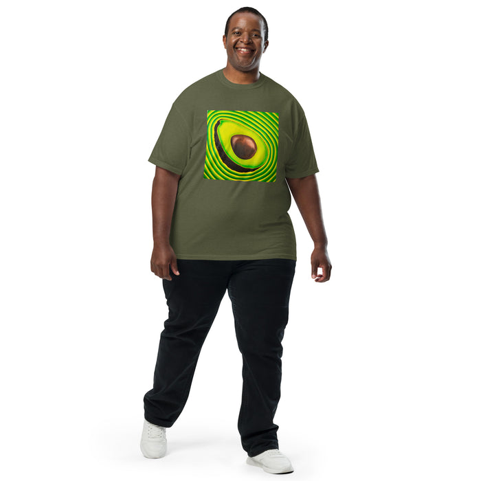 man wearing a a deep green t-shirt with realistic art of an avocado radiating green and yellow bands of energy