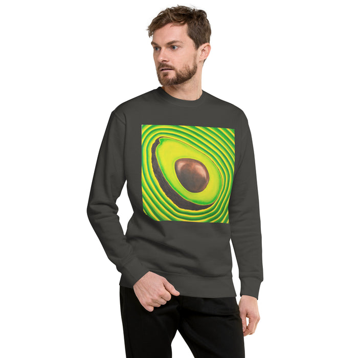 A man wearing a dark gray crewneck sweatshirt with a large, vibrant green and yellow avocado graphic on the chest, set against a plain white background.