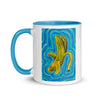 white and blue mug with abstract banana artwork