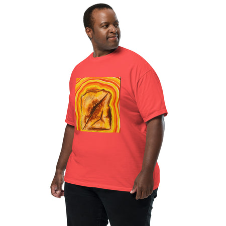 man wearing a neon orange  t-shirt with a graphic design of a psychedelic grilled cheese on the front and 'Bardo Kid' logo on the back.