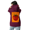 A woman shown from the back wearing a maroon hoodie with a large graphic print of a red tomato inside concentric orange rings on the back, paired with light blue sweatpants against a plain white background.
