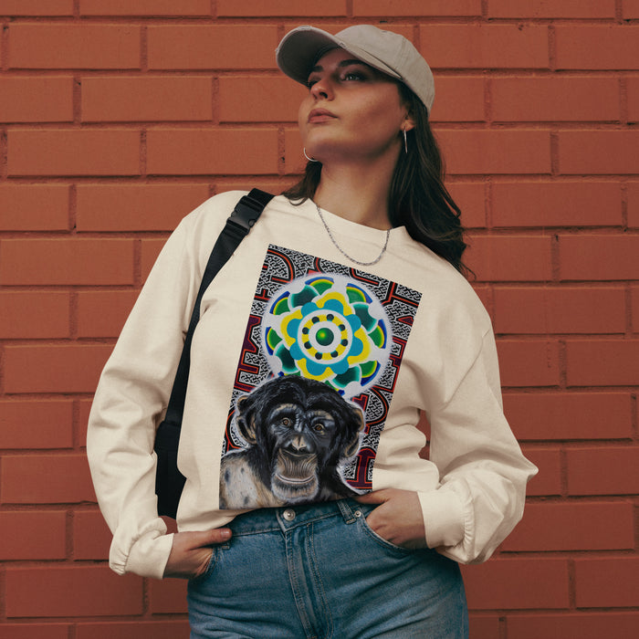 a beige long sleeve t-shirt with a chimp face  in front of a green and yellow circular mandala and a psychedelic geometric background of reds and whites.