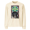 a beige long sleeve t-shirt with a chimp face  in front of a green and yellow circular mandala and a psychedelic geometric background of reds and whites.
