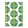 white duvet with an abstract circular repeating pattern made of circles in turquoise, green, and yellow.