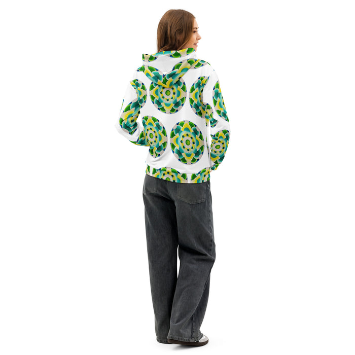 white hoodie with an all over repeating print of a circular based mandala made of  turquoise, yellow, and green colored orbs