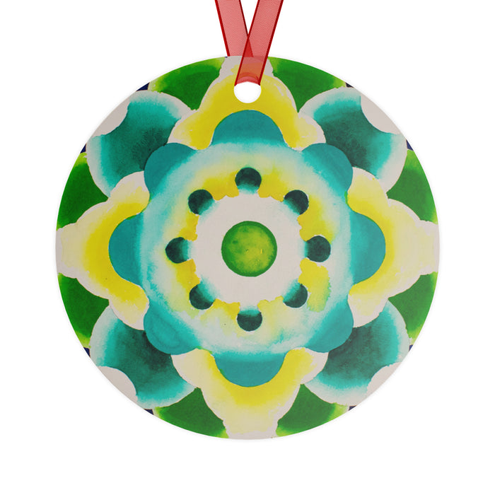 a circular Christmas ornament featuring a circle based mandala of greens, yellows and turquoises.
