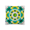 square throw pillow with aqua colored circular mandala art