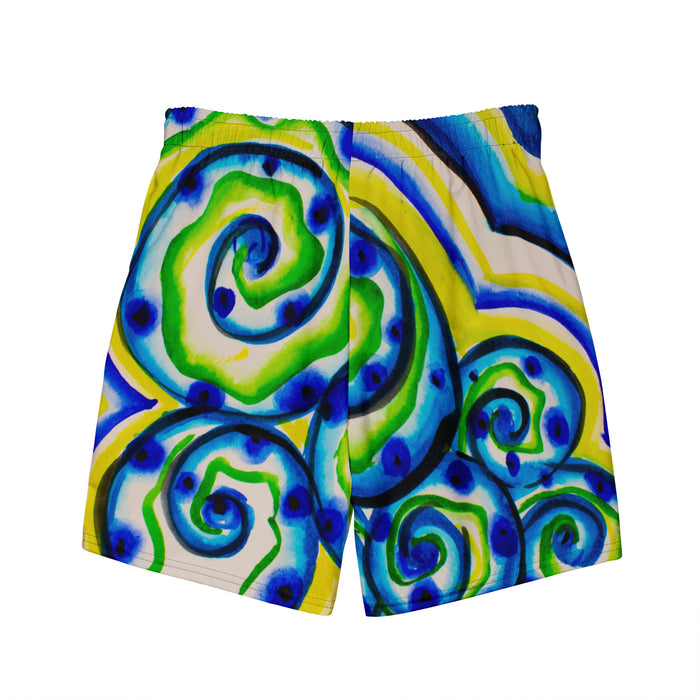 shorts with an all over print of watercolor circular art in greens and blues