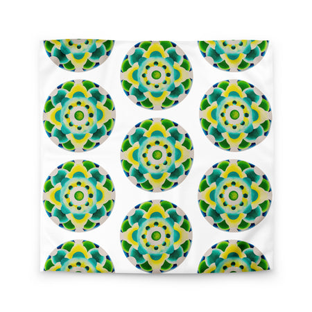white duvet with an abstract circular repeating pattern made of circles in turquoise, green, and yellow.