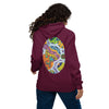 A woman viewed from behind wearing a maroon hoodie with a large, colorful psychedelic egg-shaped graphic printed on the back, paired with blue jeans against a plain white background.