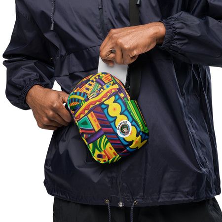 man reaching int a cross body bag with an all over multicolored psychedelic artwork print