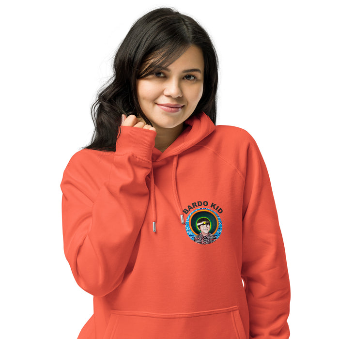 A woman wearing a bright coral-orange pullover hoodie with a colorful 'bardo Kid' graphic on the left chest, set against a plain white background.