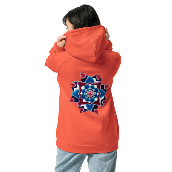 A woman shown from the back wearing a bright coral-orange hoodie with a large colorful mandala graphic on the back, paired with light blue jeans, against a plain white background.