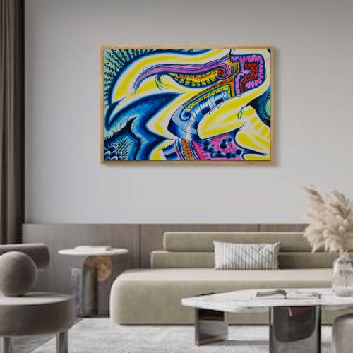 A colorful abstract framed wall art print hangs above a beige sofa in a modern living room setting. The artwork features bold, flowing shapes in blue, yellow, purple, and green.