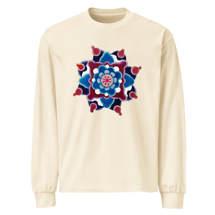 a beige long sleeve t-shirt featuring original watercolor art of a mandala made up of magenta, turquoise, and maroon circular forms.