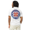 man wearing white polo shirt with BardoKid logo on upper right chest and a psychedelic flower design in reds, blue, and orange on back.