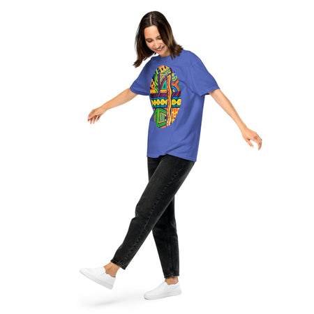 girl wearing a a light blue t-shirt with a vibrant, psychedelic multicolored tubular design contained within an oval shape.