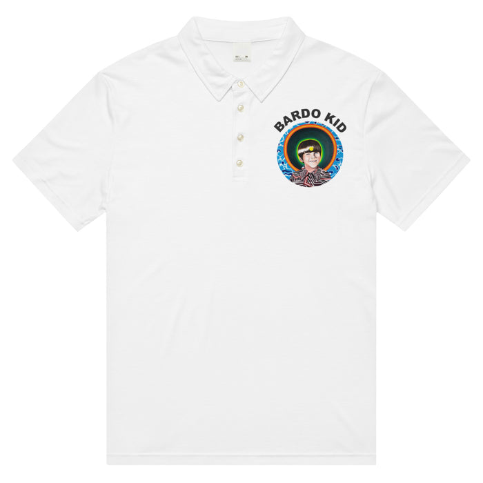 a white polo shirt with the Bardo Kid log on the front upper right chest and a psychedelic flower design in reds, blues, and oranges on the back.