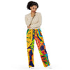 girl wearing soft, comfy lounging pants with all over psychedelic multicolored geometric designs