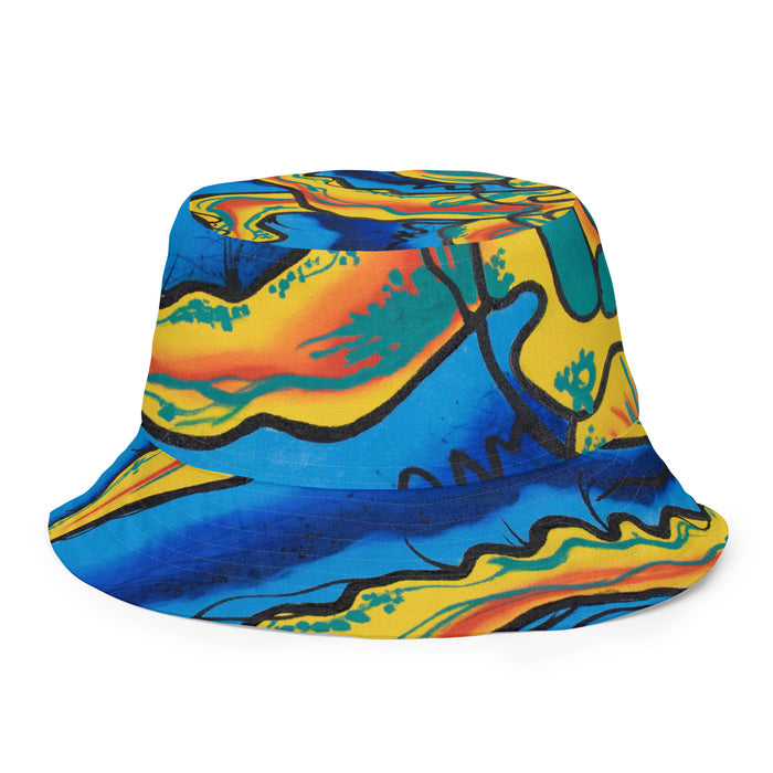 all over print reversible bucket hat with graffiti inspired artwork with turquoise, blue, orange, red, and yellow.