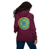 A woman viewed from behind wearing a maroon hoodie with a large circular mandala graphic in yellow and teal on the back, paired with blue jeans against a plain white background.
