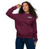 Woman wearing a maroon hoodie with a bardo kid brand logo on a white background