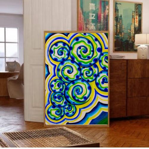 A framed abstract art print featuring vibrant blue, green, and yellow swirling patterns, displayed in a modern living room setting next to a wooden cabinet.