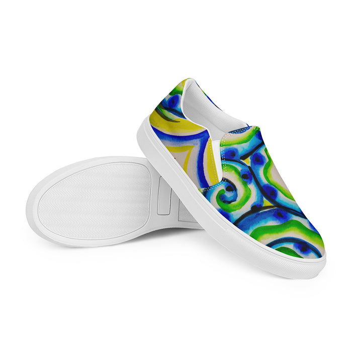 womens slip on canvas shoes with all over multicolored print in swirling blues and greens