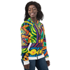 Person wearing a colorful psychedelic patterned hoodie on a white background